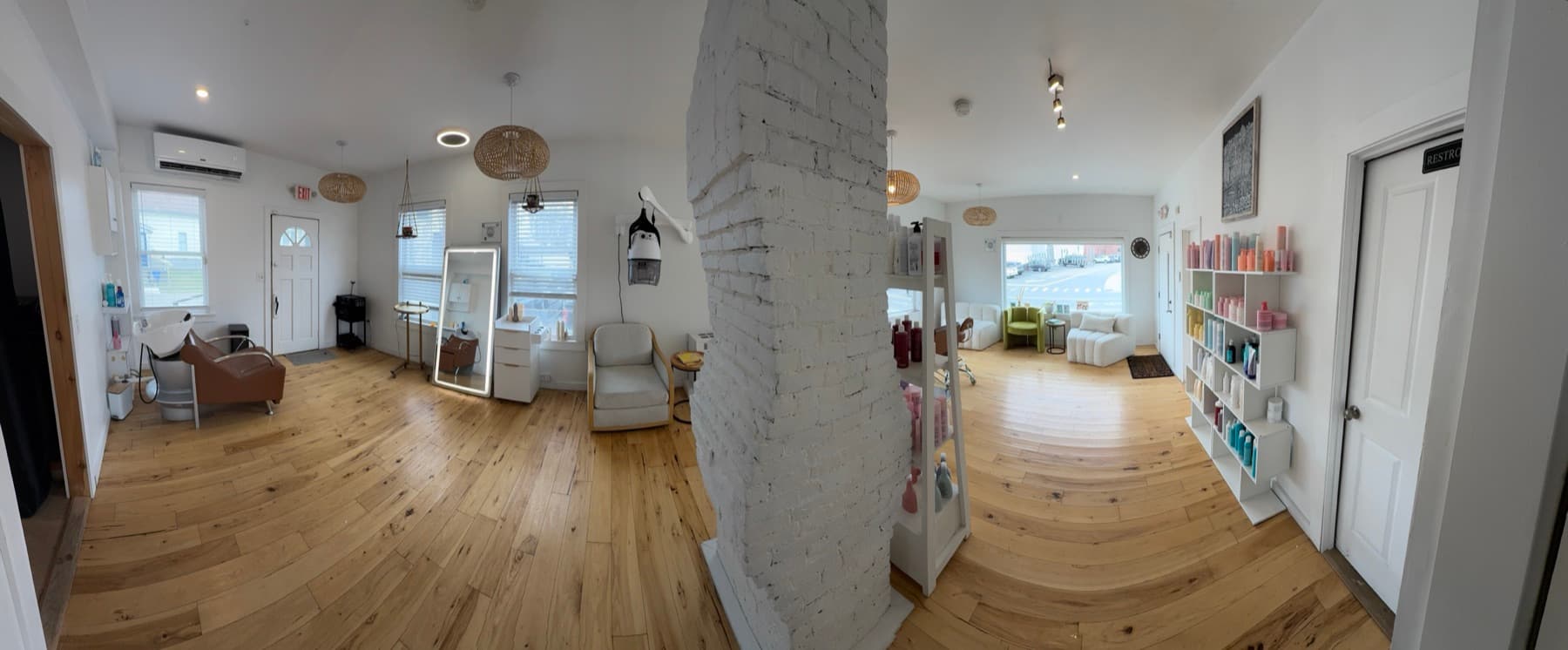 Salon St Pierre back room with natural light and open floor plan